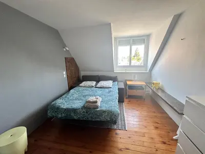 Un ou plusieurs lits dans un hébergement de l'établissement Grande maison hyper centre