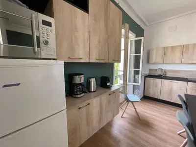 Cuisine ou kitchenette dans l'établissement Le Logis de la Place