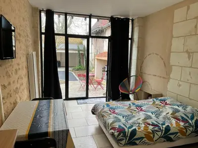 Un ou plusieurs lits dans un hébergement de l'établissement Guest House de Céline et Benoît