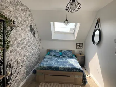 Un ou plusieurs lits dans un hébergement de l'établissement Logement au calme à 20 minutes a pied du circuit avec garage privé