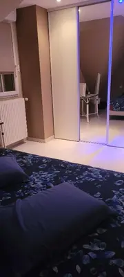 Coin salon dans l'établissement Chambre chez particulier 10mn du circuit