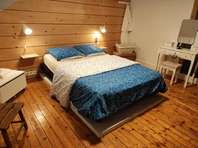 Un ou plusieurs lits dans un hébergement de l'établissement Chambres d'hôtes de charme sur LE MANS