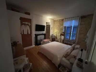 Un ou plusieurs lits dans un hébergement de l'établissement Chambres d'hôtes de charme sur LE MANS