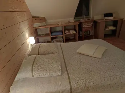 Un ou plusieurs lits dans un hébergement de l'établissement Chambres d'hôtes de charme sur LE MANS