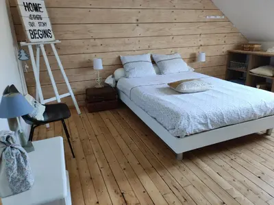 Un ou plusieurs lits dans un hébergement de l'établissement Chambres d'hôtes de charme sur LE MANS