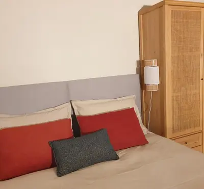 Un ou plusieurs lits dans un hébergement de l'établissement Maisonnette cosy cœur centre avec accueil vélo
