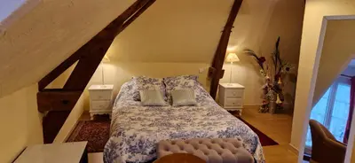 Un ou plusieurs lits dans un hébergement de l'établissement Gîte d'Isabelle, dépendance du château de la Mézière