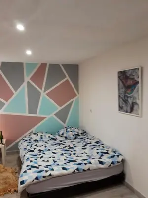 Un ou plusieurs lits dans un hébergement de l'établissement Maison confortable à Loches + Jardin spacieux