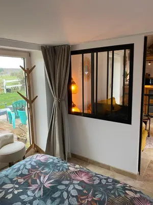 Un ou plusieurs lits dans un hébergement de l'établissement Tiny housse la Poitevinière