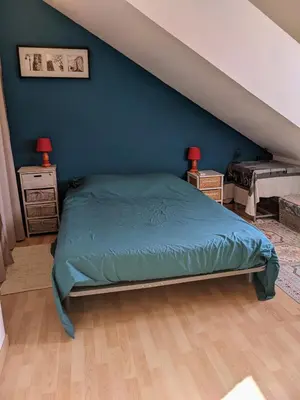 Un ou plusieurs lits dans un hébergement de l'établissement Chambres d'hôtes La Charmante