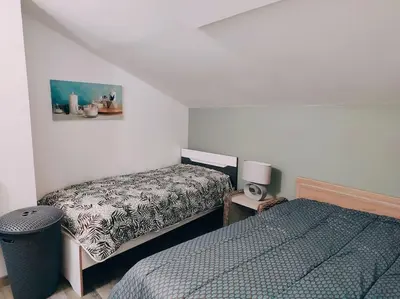 Un ou plusieurs lits dans un hébergement de l'établissement Maison chaleureuse située à Saumur