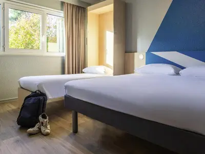 Un ou plusieurs lits dans un hébergement de l'établissement ibis budget Tours Sud