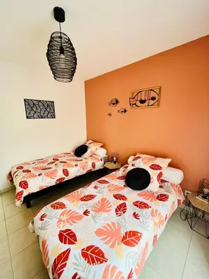 Un ou plusieurs lits dans un hébergement de l'établissement Gîte Romarin