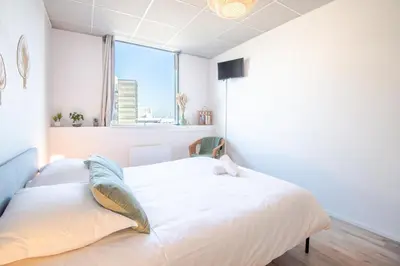 Un ou plusieurs lits dans un hébergement de l'établissement Appartement Le Cocooning