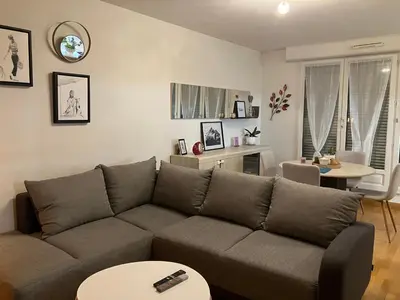 Coin salon dans l'établissement Appartement centre avec place de parking tout inclus