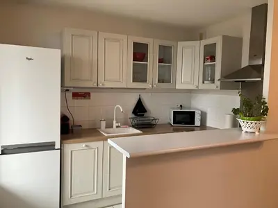 Cuisine ou kitchenette dans l'établissement Appartement centre avec place de parking tout inclus