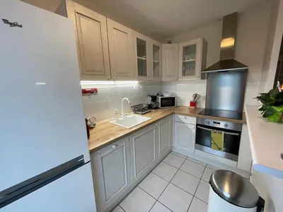 Cuisine ou kitchenette dans l'établissement Appartement centre avec place de parking tout inclus
