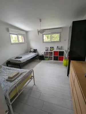 Un ou plusieurs lits dans un hébergement de l'établissement Anne et Stan - Chambres avec petit dejeuner - proche centre ville et circuit