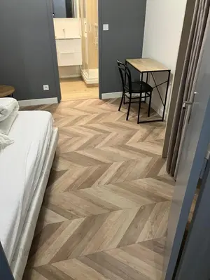 Un ou plusieurs lits dans un hébergement de l'établissement Grand Studio proche st pierre/château