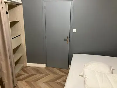 Un ou plusieurs lits dans un hébergement de l'établissement Grand Studio proche st pierre/château