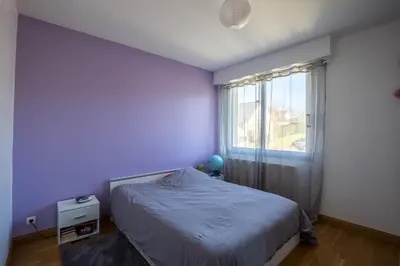 Un ou plusieurs lits dans un hébergement de l'établissement Le Cottage - circuit Bugatti - wifi - 8pers - Rêve au Mans