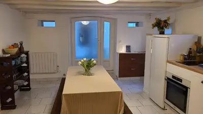 Cuisine ou kitchenette dans l'établissement Le Petit Lavoir - Maison Cosy à Mayet
