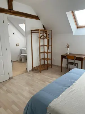 Un ou plusieurs lits dans un hébergement de l'établissement Le Petit Lavoir - Maison Cosy à Mayet