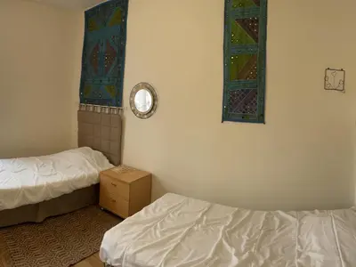 Un ou plusieurs lits dans un hébergement de l'établissement Maison charmante près de la ville - FR-1-410-386