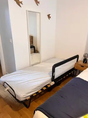 Un ou plusieurs lits dans un hébergement de l'établissement Le Rabelais, superbe appartement en duplex, proche forteresse et monument historique