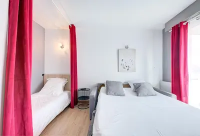 Un ou plusieurs lits dans un hébergement de l'établissement Studio Grammont 4