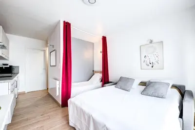 Un ou plusieurs lits dans un hébergement de l'établissement Studio Grammont 4