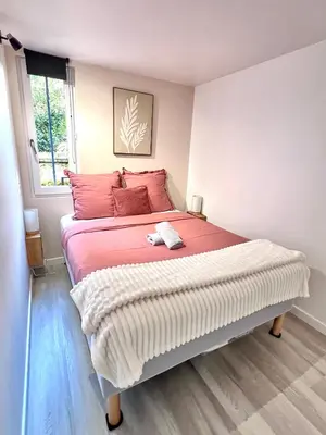 Un ou plusieurs lits dans un hébergement de l'établissement Le Badebec, Appt dans maison typique avec jardin privé