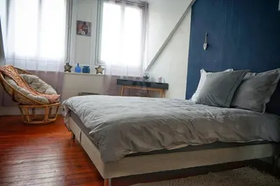 Un ou plusieurs lits dans un hébergement de l'établissement Le char'Mans appartement cosy proche gare et tram