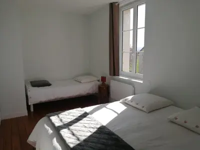 Un ou plusieurs lits dans un hébergement de l'établissement Gîte 4 etoiles à la campagne