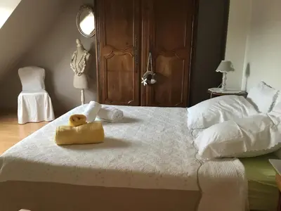 Un ou plusieurs lits dans un hébergement de l'établissement B and B chambres d’hôtes 24 h du Mans et Le Mans Classic