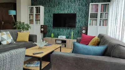 Télévision ou salle de divertissement dans l'établissement Nadine & Didier