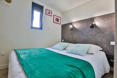 Un ou plusieurs lits dans un hébergement de l'établissement Chalet Campagne Les Belles Ouvrières
