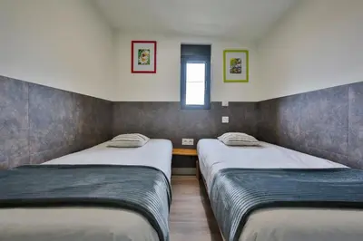 Un ou plusieurs lits dans un hébergement de l'établissement Chalet Campagne Les Belles Ouvrières