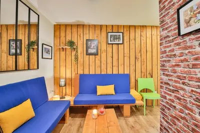 Coin salon dans l'établissement Chalet Campagne Les Belles Ouvrières