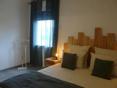 Un ou plusieurs lits dans un hébergement de l'établissement A DEUX PAS DE BEAUVAL - LE GITE