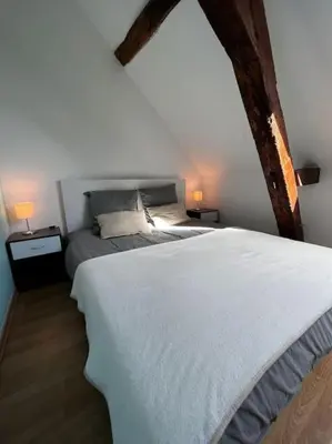 Un ou plusieurs lits dans un hébergement de l'établissement Gîte du Coudray
