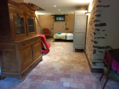Un ou plusieurs lits dans un hébergement de l'établissement Chambre d'hôtes à proximité du circuit des 24h