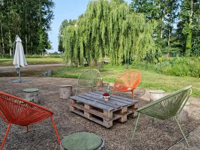 Jardin de l'établissement L 'Aupinouse Chambre double Pivoine avec salle d'eau privative