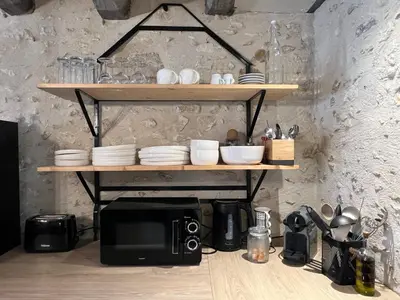 Cuisine ou kitchenette dans l'établissement Le Cottage des Chalands