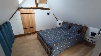 Un ou plusieurs lits dans un hébergement de l'établissement Maison charmante