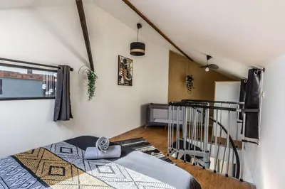 Un ou plusieurs lits dans un hébergement de l'établissement L'Atypique-Le LOFT du Mans