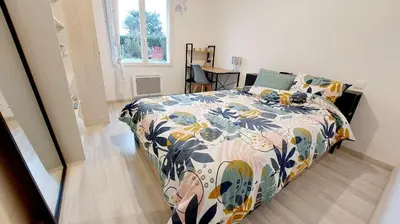Un ou plusieurs lits dans un hébergement de l'établissement Maison d'hôtes avec jardin 3 chambres pour 7 à 45 min circuit 24h du Mans