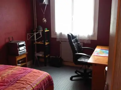 Un ou plusieurs lits dans un hébergement de l'établissement Chambre Olivier
