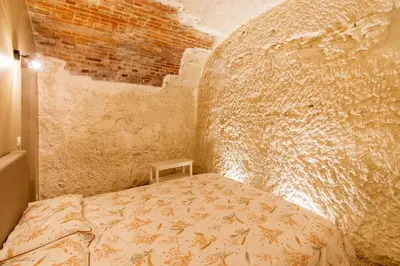 Un ou plusieurs lits dans un hébergement de l'établissement Gîte troglodyte - Troglo du Pontcher