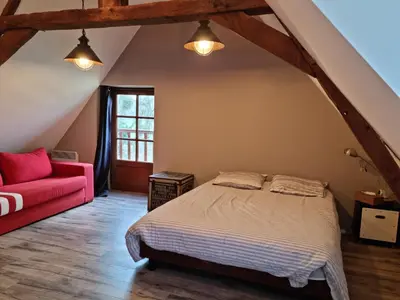 Un ou plusieurs lits dans un hébergement de l'établissement L'Aupinouse Chambre double Chardon, au 1er étage avec salle d'eau privative